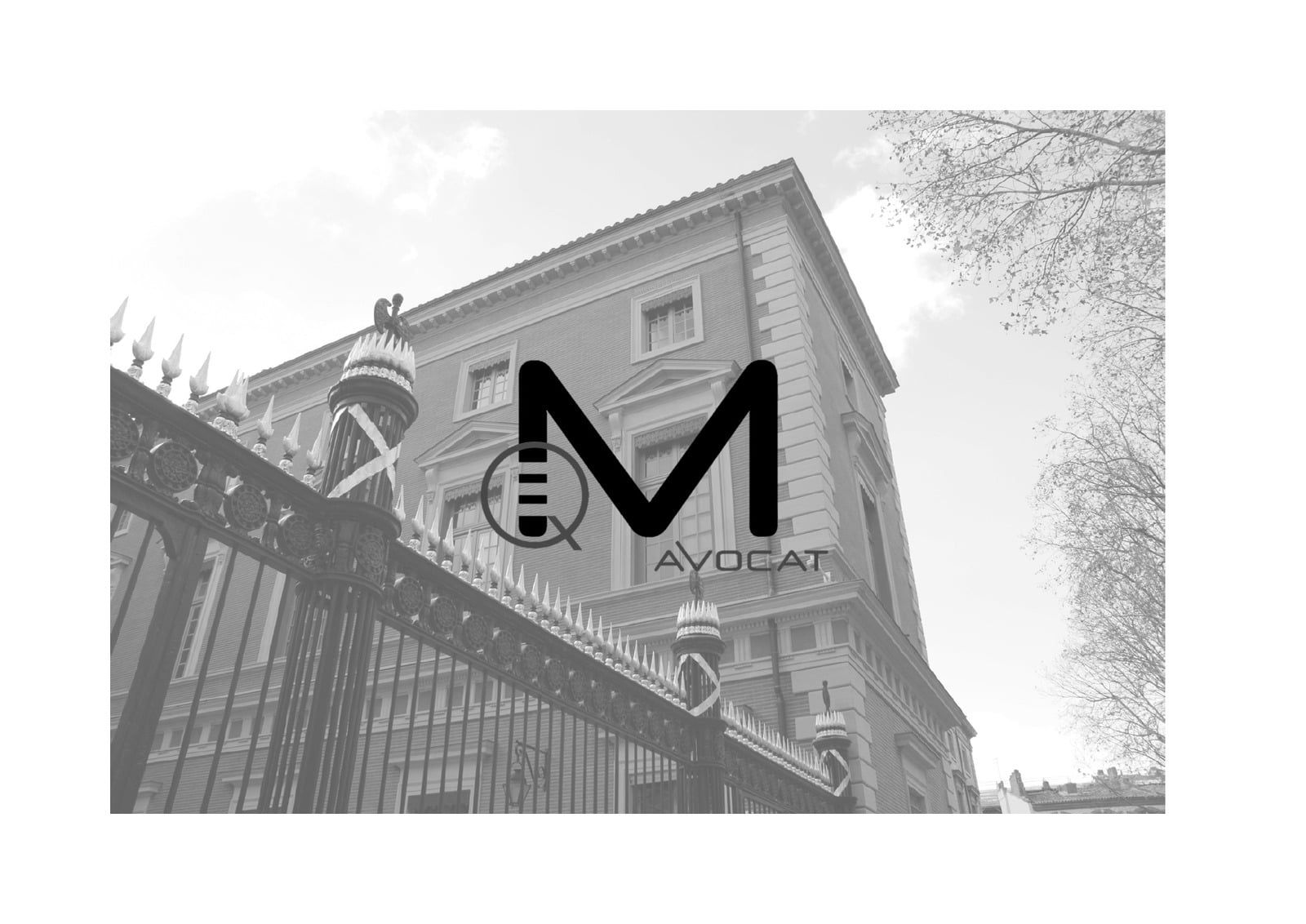Façade d'un immeuble toulousain avec le logo Quentin Maghia Avocat